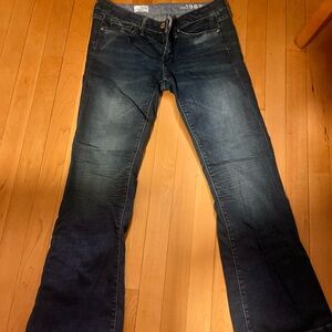 Blue Boot Cut Jeans with Modern Distressing